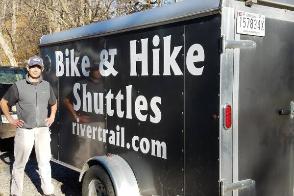 Employee in front of Bike & Hike Shuttle - River & Trail Outfitters