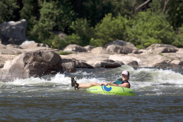 Happy tuber on whitewater near Harpers Ferry - River & Trail Outfitters